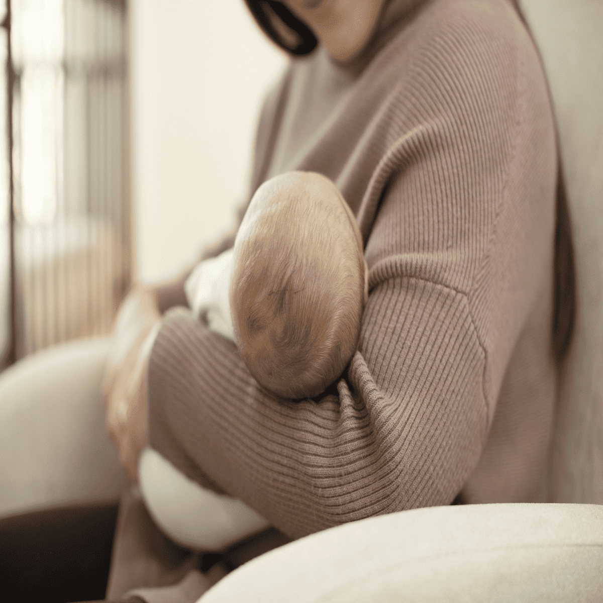 mom holding newborn baby